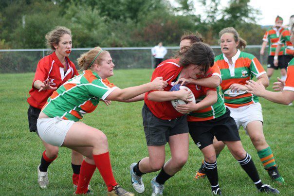 Wisconsin flanker Sarah Whaley draws three defenders (and a bit of a high tackle) on her attack run. 