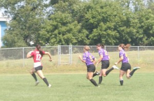 Wisconsin's Inside Center Nicole Helmer breaks away from the Palmer defense to run in a try.