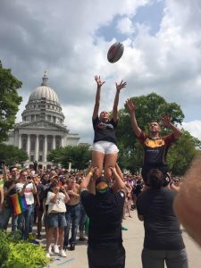 WWRFC takes a break during the Madison Pride parade to practice lifting, Spring 2018